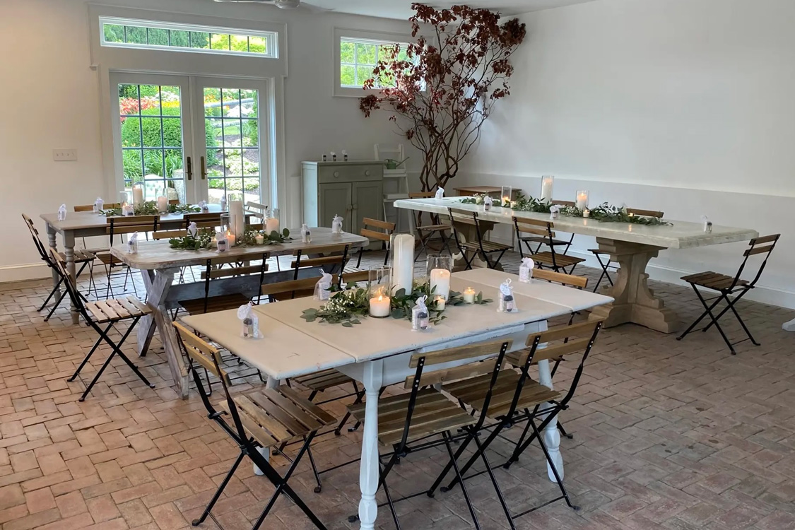 Table settings inside the cottage at The Gardens at Uncanoonuc Mountain.