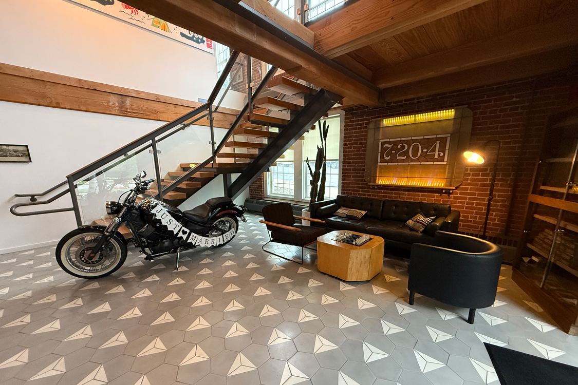 A motorcycle inside of the Big Brick Lounge at The Gardens at Queen City Center.